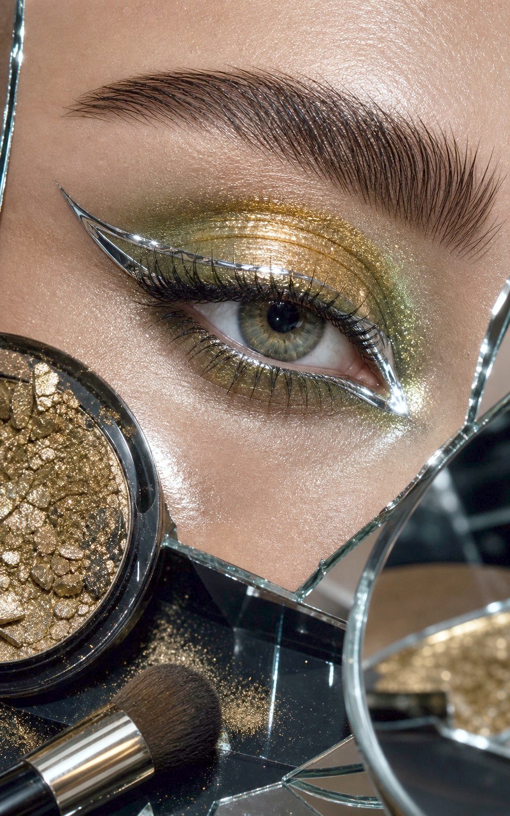 Gold asymmetric eye makeup detail